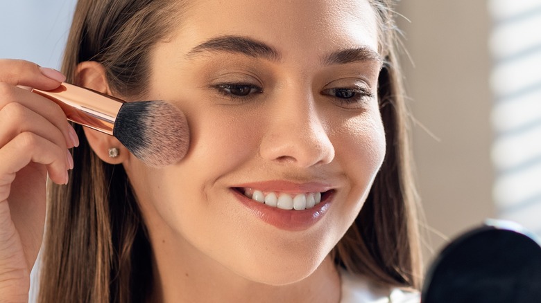 Woman using cosmetics 