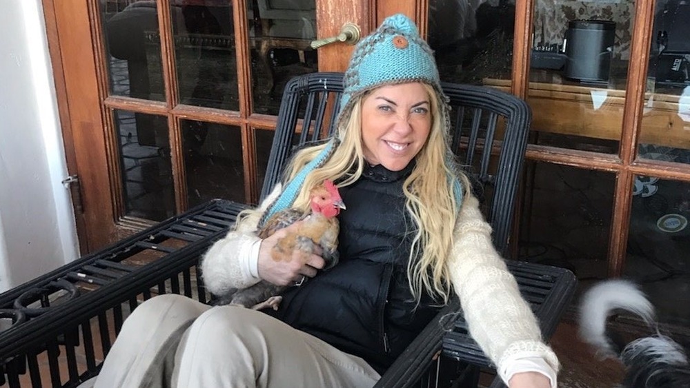 Elaine Culotti smiling near animals