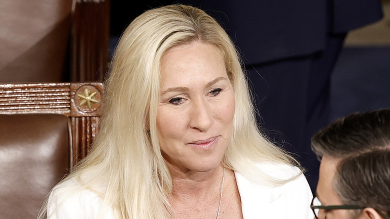Marjorie Taylor Greene talks with House Speaker Mike Johnson in Congress