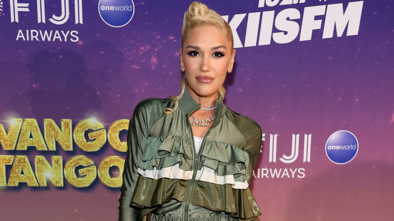 Gwen Stefani wearing a green jacket