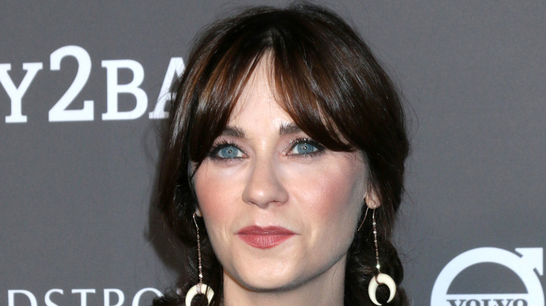 Zooey Deschanel posing at an event