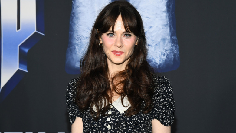 image of Zooey Deschanel on the red carpet of a movie premiere