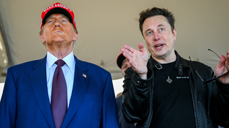 Donald Trump's bronzer looks blotchy as he stands beside a gesturing Elon Must during the the sixth test flight of the SpaceX Starship rocket.