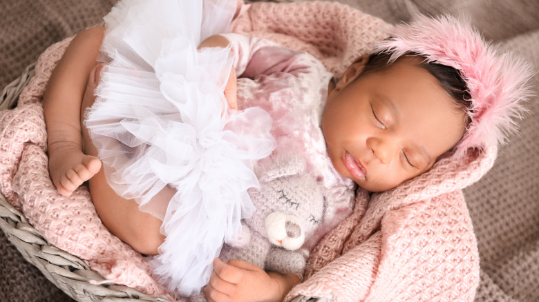 Baby sleeping in basket