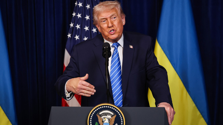 Donald Trump at podium gesturing