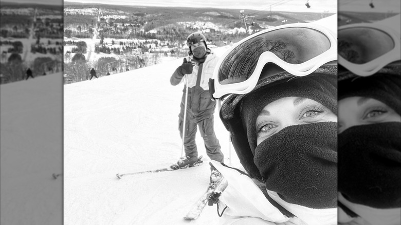 Dave and Kortney Wilson posing for a photo while skiiing