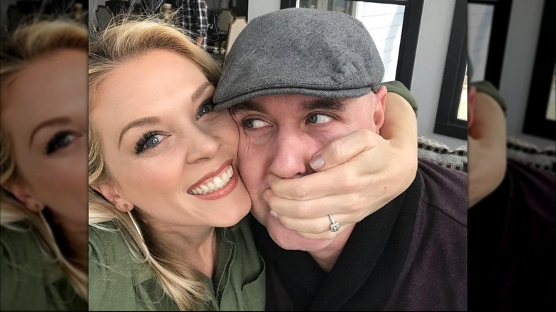 Kortney Wilson covering Dave Wilson's mouth while taking a selfie in 2018