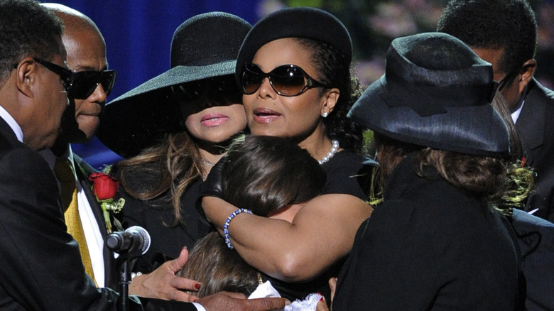Janet Jackson with hugging Paris Jackson during Michael Jackson's memorial service.