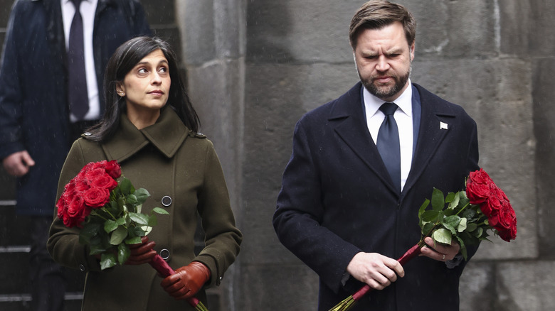 JD Vance and wife Usha Vance hold flowers as they walk to the Eternal Flame during a visit to the Tsitsernakaberd Armenian Genocide Memorial on February 10, 2026.