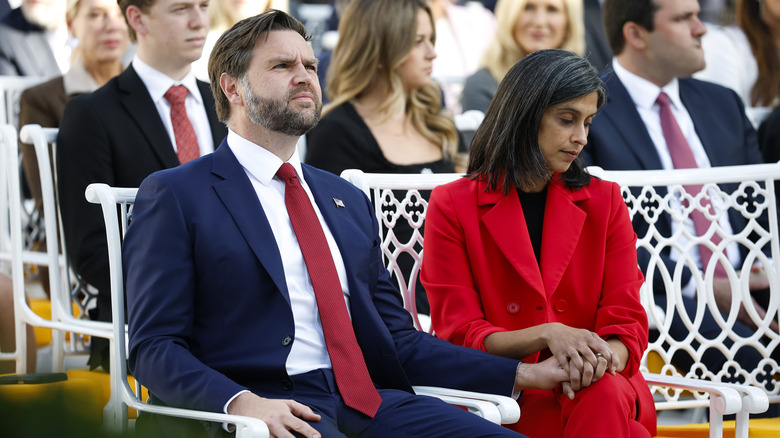 JD Vance (L) sits with his wife Usha Vance prior to a Presidential Medal of Freedom ceremony in the Rose Garden of the White House on October 14, 2025.