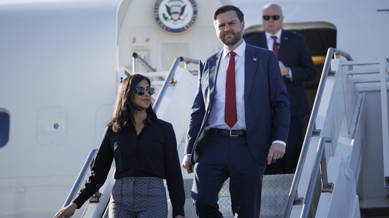Usha and JD Vance getting off of an airplane