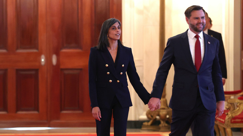 Usha Vance holding hands with JD Vance