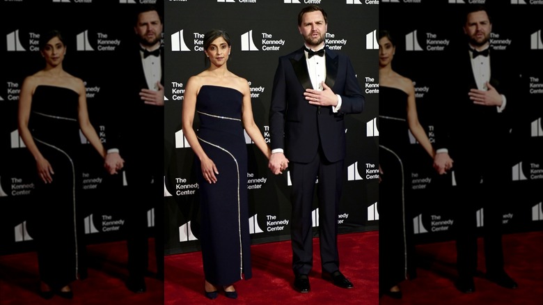 Usha Vance posing in a black dress next to JD Vance, wearing a suit and bowtie, at the premiere of 'Les Misérables.'