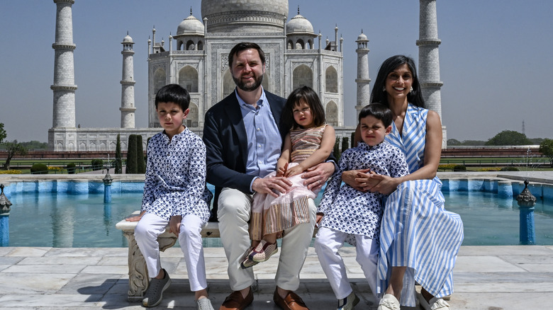 The Vance family in India seated in front of the Taj Mahal