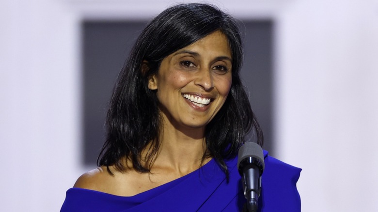 Usha Vance smiling in front of microphone