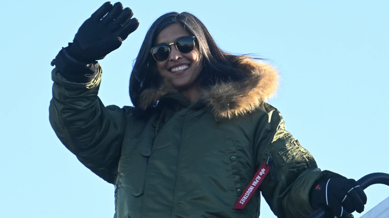 Usha Vance smiling and waving while wearing heavy winter attire