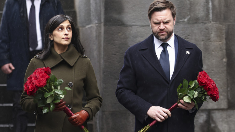 Usha and JD Vance holding flowers