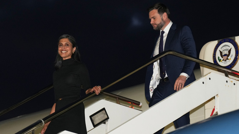 Usha and JD Vance disembark a plane