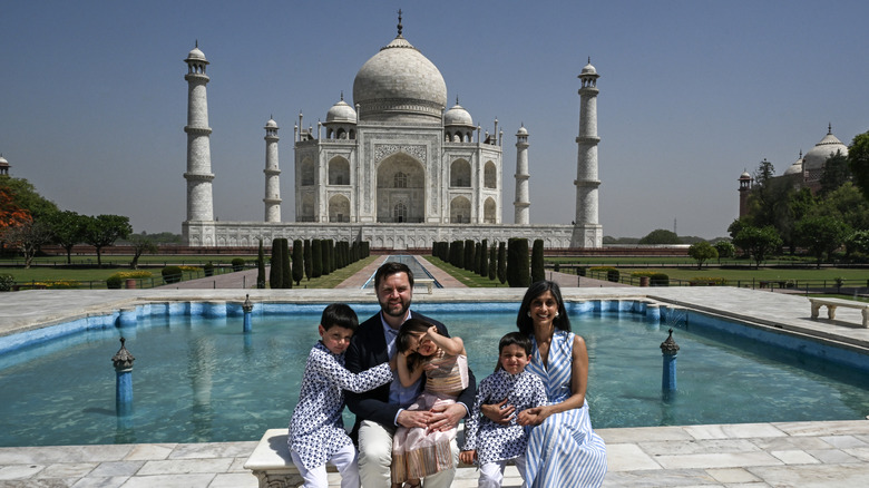 JD Vance and Usha Vance pose in front of the Taj Mahal with their kids
