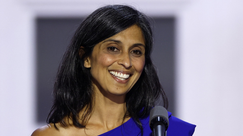 Closeup of Usha Vance smiling on podium during speech