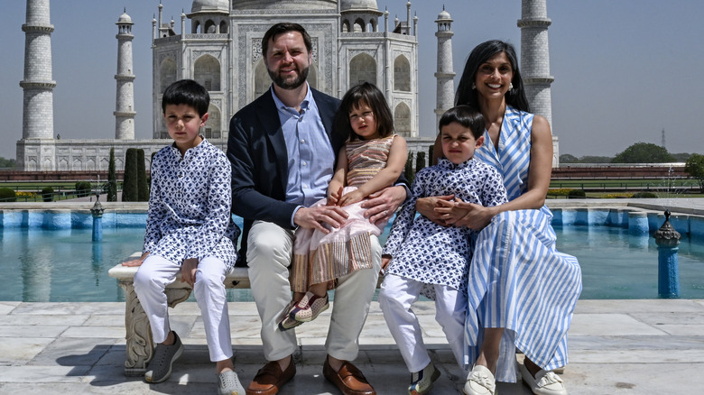 The Vance family posing in front of the Taj Mahal