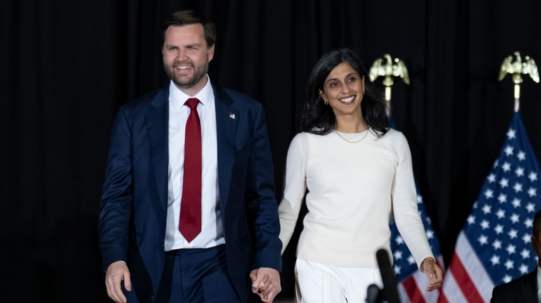Ohio Senator JD Vance arrives with his wife Usha Vance at the Vice Presidential Nominee's election rally at the Cobb Galleria Center in Atlanta, Georgia