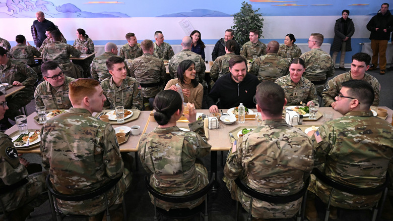 US Vice President JD (C R) and Second Lady Usha Vance (C L) eat a meal with soldiers at the US military's Pituffik Space Base on March 28, 2025 in Pituffik, Greenland
