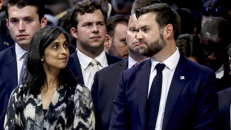 JD and Usha Vance looking at each other St. Peter's mass