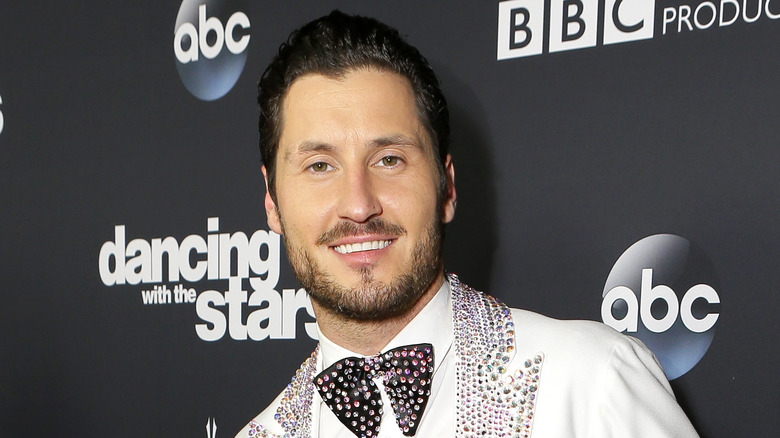 Val Chmerkovskiy poses on the carpet 