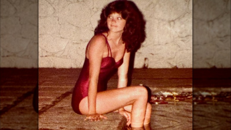 Valerie Bertinelli sitting on edge of swimming pool