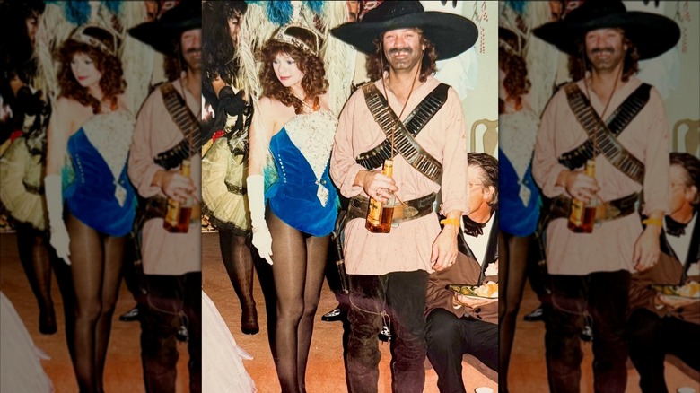 Valerie Bertinelli wearing showgirl costume next to Eddie Van Halen wearing outlaw costume