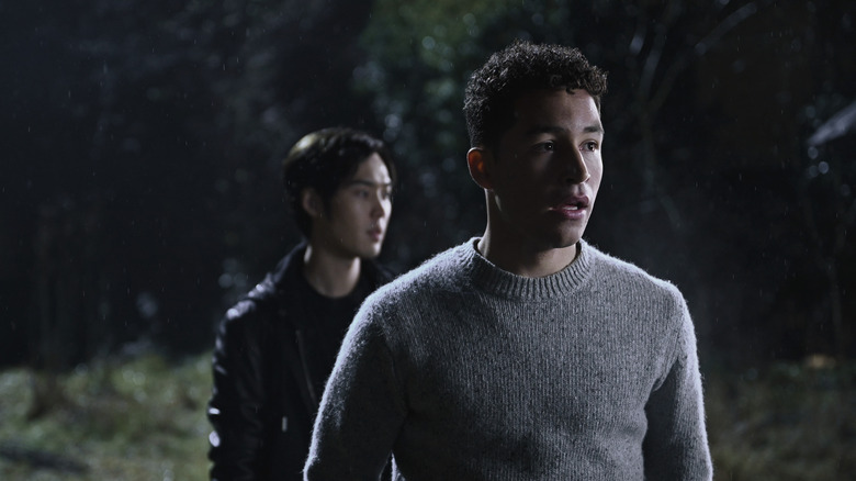 Christian standing behind shocked Mason