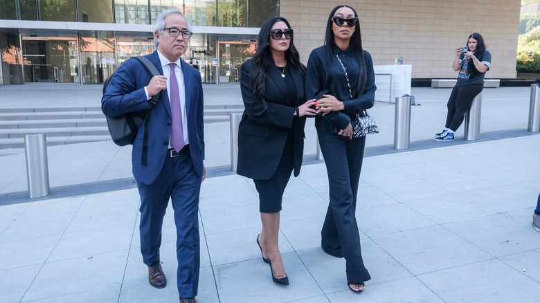 Vanessa Bryant leaving a courthouse with her attorney, Luis Li, and her friend, soccer player Sydney Leroux
