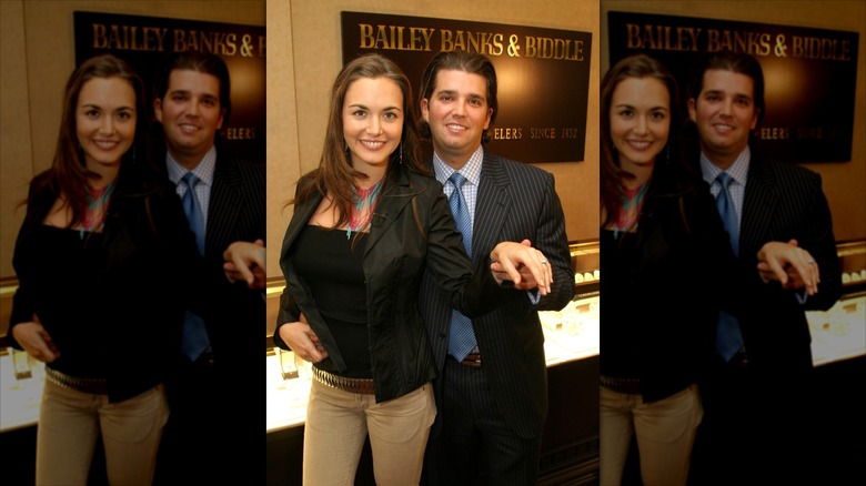Vanessa and Donald Trump Jr showing off her engagement ring in front of a Bailey Banks & Biddle sign
