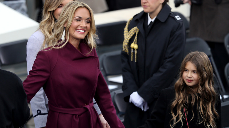 Vanessa Trump smiling and walking with her daughter on Inauguration Day in 2017