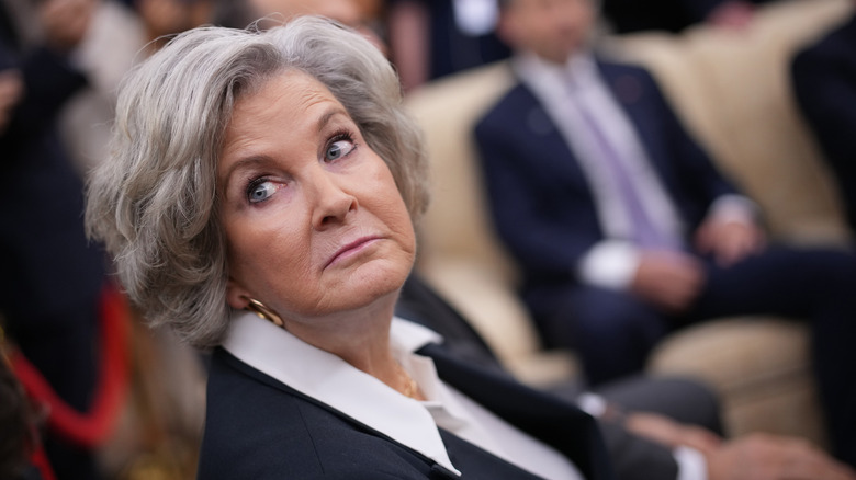 Susie Wiles side eyeing and looking over her shoulder