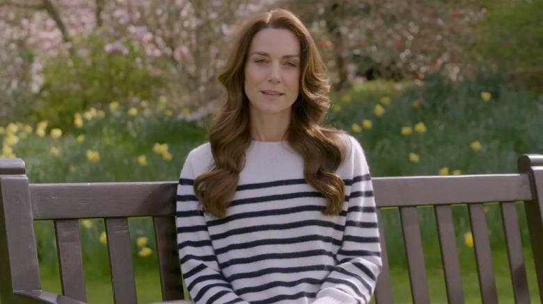 Kate Middleton sitting on a bench