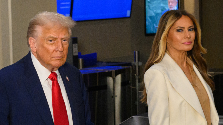 Donald and Melania Trump looking grim