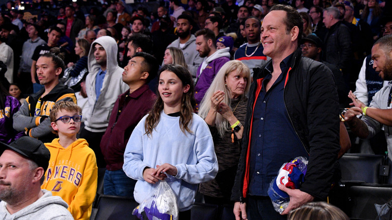 Vince Vaughn at a basketball game with children Vernon and Locklyn