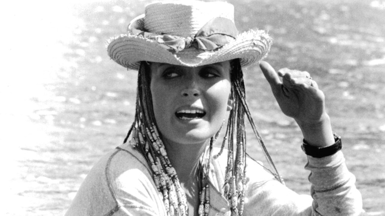 Bo Derek wearing a cowboy hat and braids