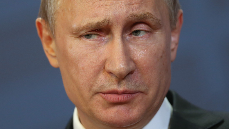 Vladimir Putin looks dubious about something