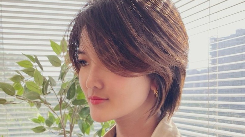 person with bixie haircut