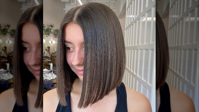 Woman with sliced bob haircut