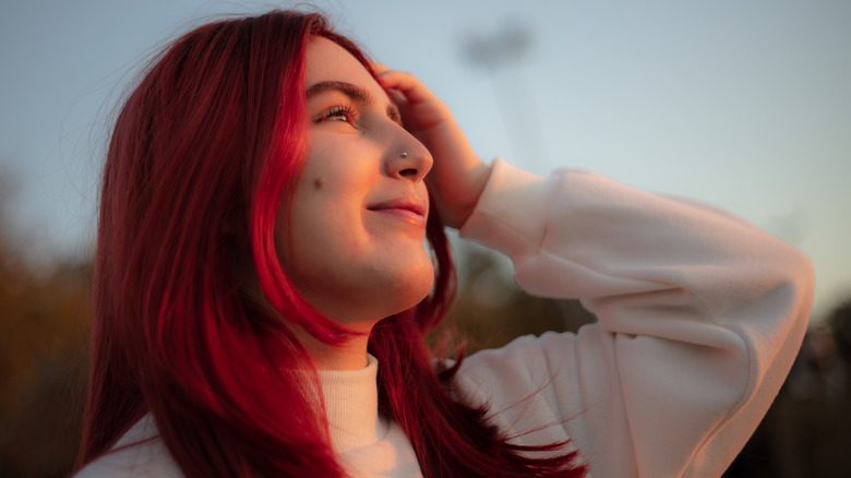 Woman with sunset red hair