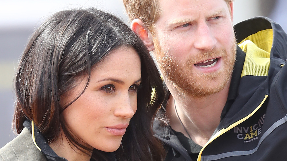 Meghan and Harry looking off-camera