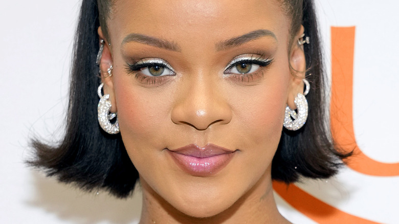 Rihanna smiling on red carpet