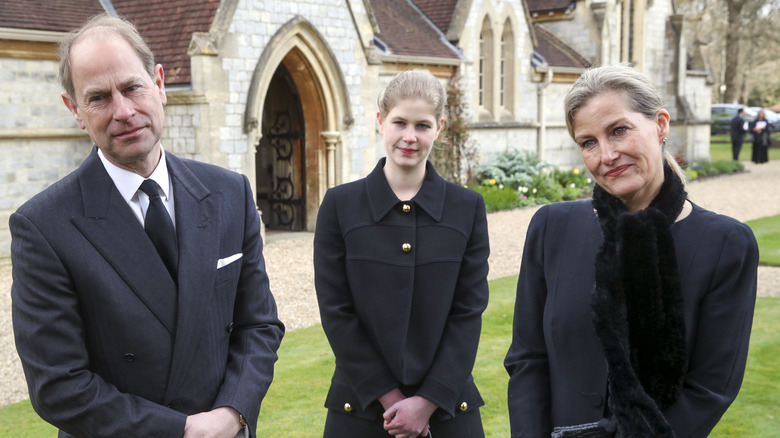 Prince Edward with Sophie and Louise dressed in black