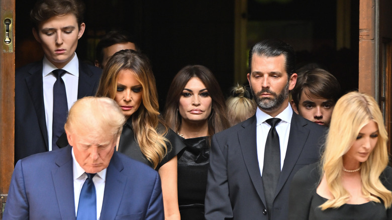 The Trump family looks somber