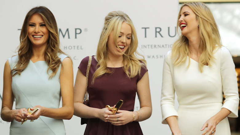 Melania, Tiffany, and Ivanka Trump laughing