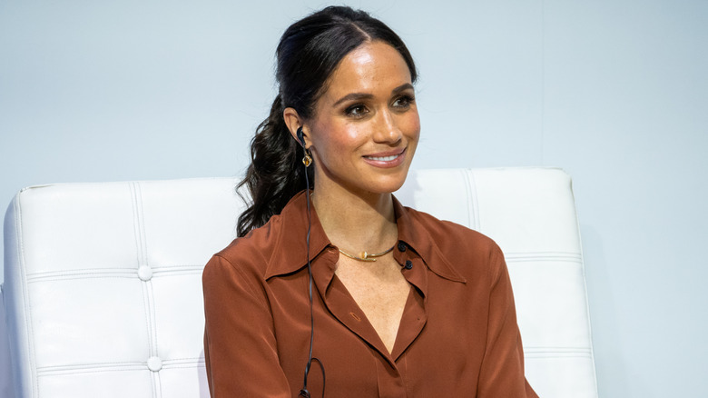 Meghan on a stage at EAN University, August 2024